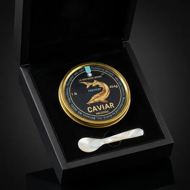 The La Mer Noire gift box — a gold-lidded tin of Ossetra caviar with a mother-of-pearl spoon in a black presentation box.